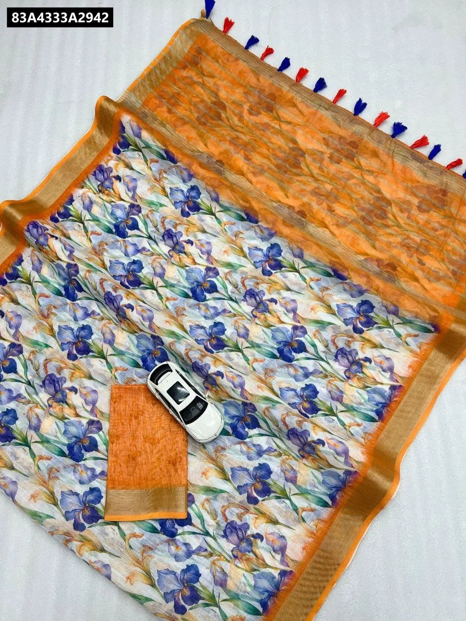 Digital Print Linen Saree in Orange Floral with Silver Jari Border and Tassels