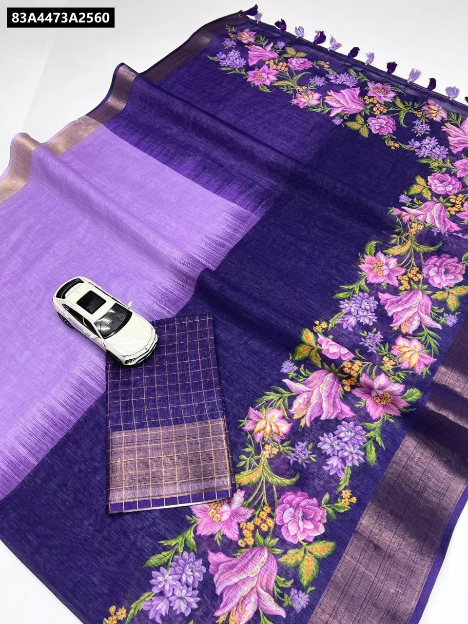 TRENDBUY Indigo and Lavender Linen Saree with Digital Floral Print and Gold Jari Border, featuring tassels and matching blouse piece.