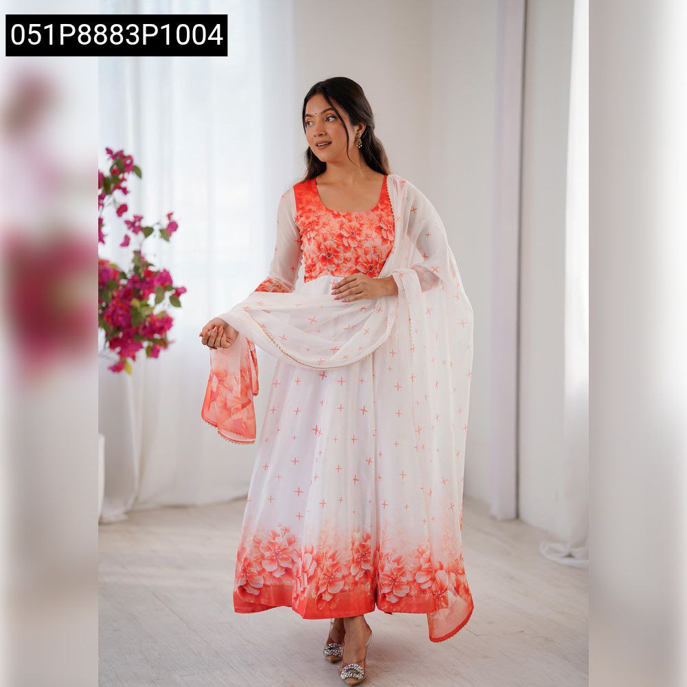 Model posing elegantly in a white and orange floral digital print gown with dupatta.