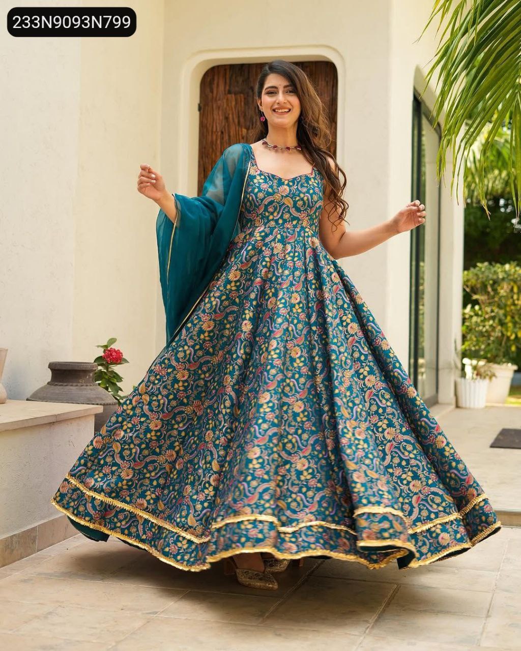 Model twirling, demonstrating the huge 8-meter flair of the digital printed anarkali gown.