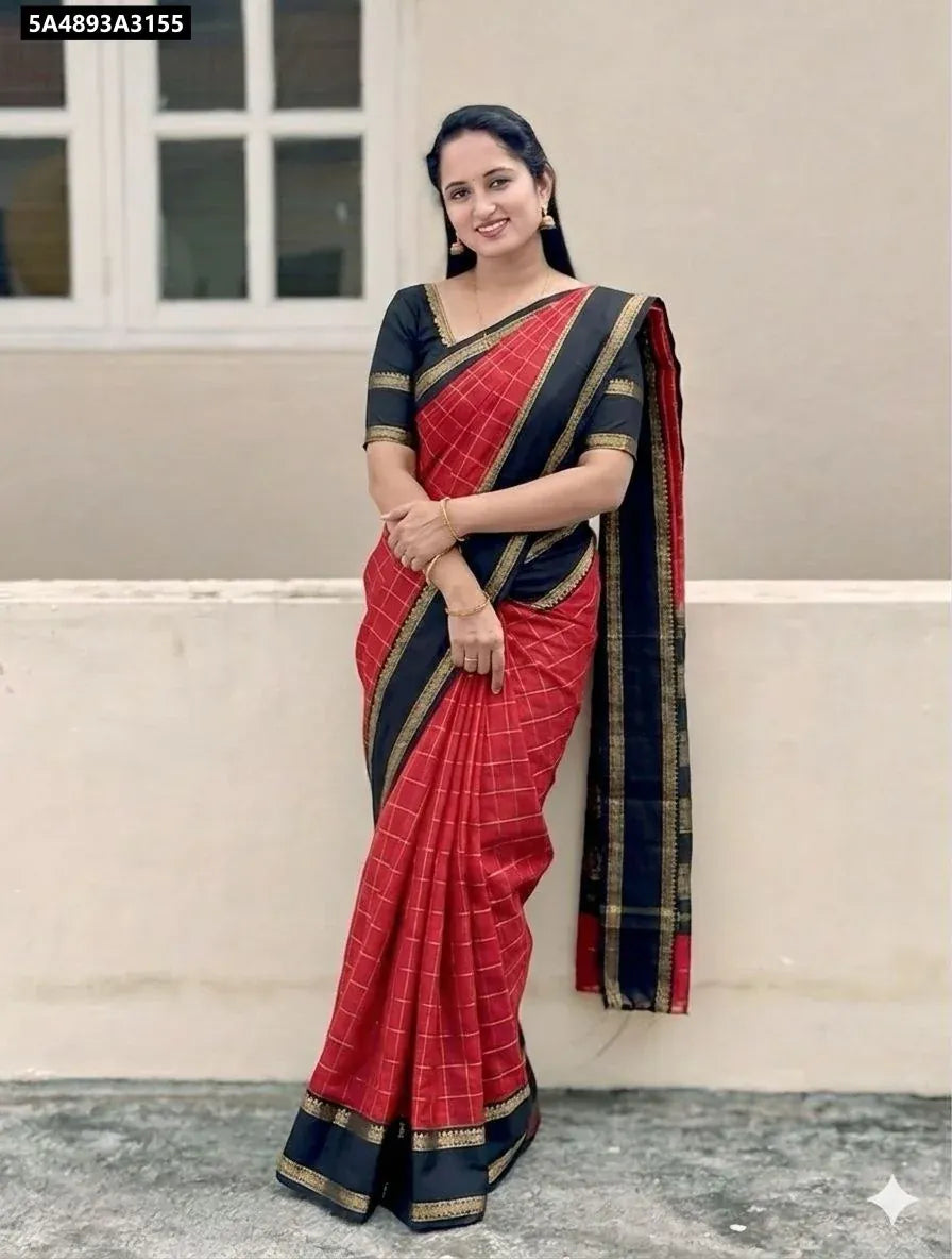 Model wearing a red and black Dola Silk Saree with checkered pattern and zari border.