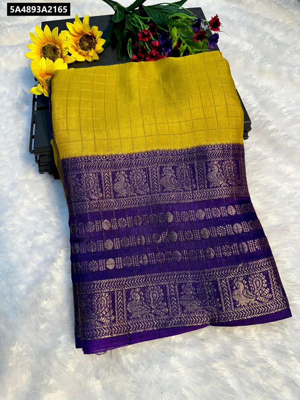 TRENDBUY Yellow Dola Silk Saree with purple Kalamkari Zari Hamsa border, folded elegantly.