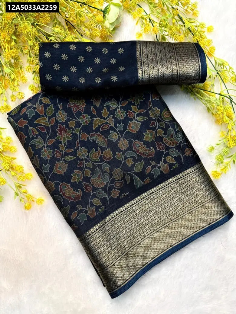 Midnight Blue Dola Silk Saree with multi-color Pen Kalamkari floral design and golden Zari Hamsa border, flat lay with matching blouse piece.