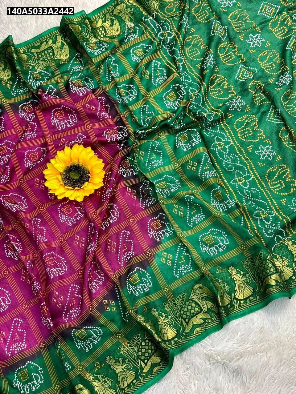 TRENDBUY Dual Tone Art Silk Bandhej Saree in Emerald Green and Maroon, flat lay view with sunflower