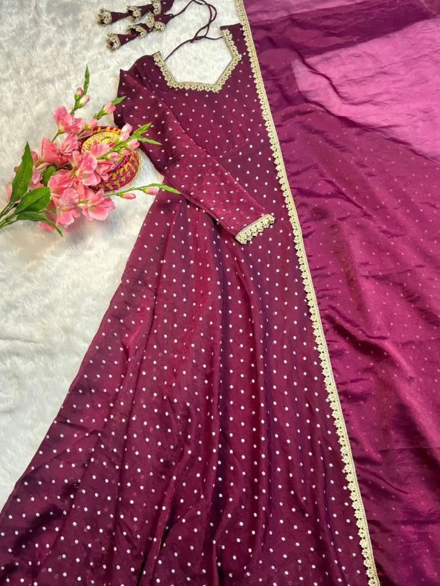 Deep wine NC moss Anarkali gown with pearl lace dupatta on a plush white background