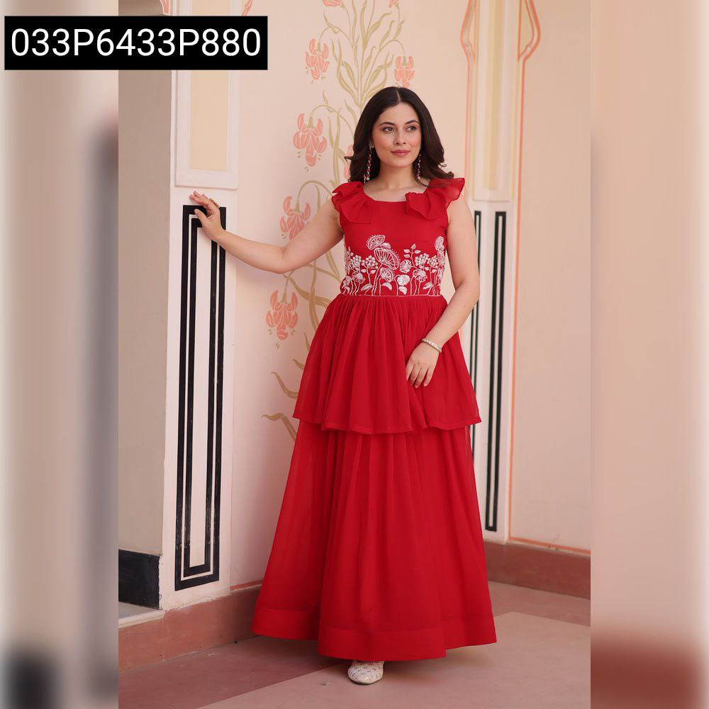 Model posing in an elegant red embroidered layered women's gown, front view.