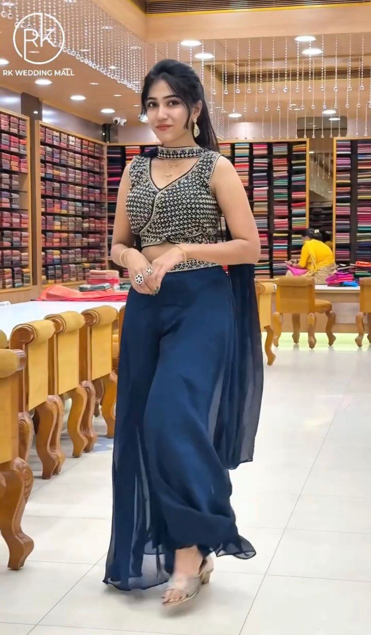 Woman in navy blue embroidered palazzo set with dupatta by TRENDBUY