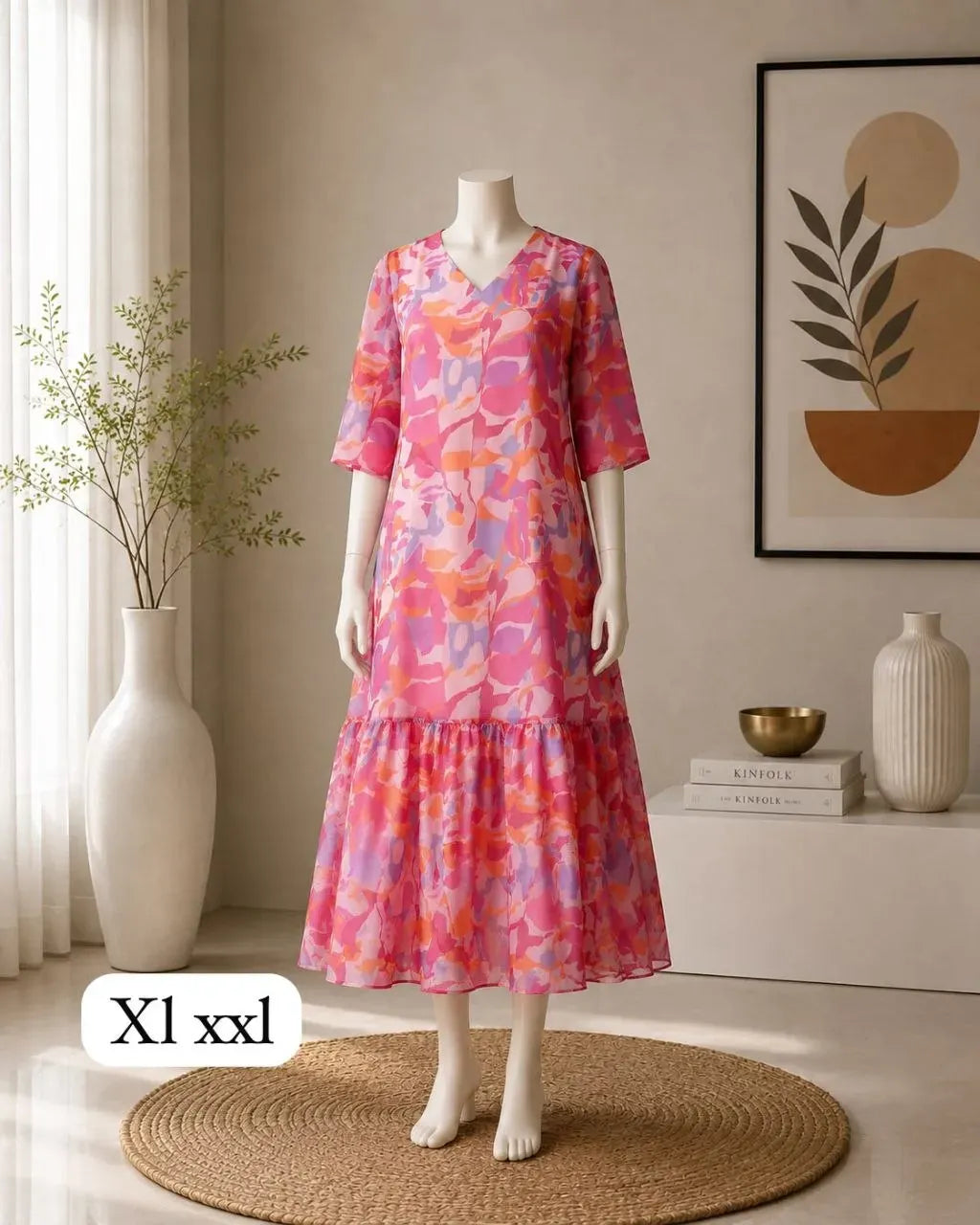 Pink floral A-line midi dress on mannequin with V-neck