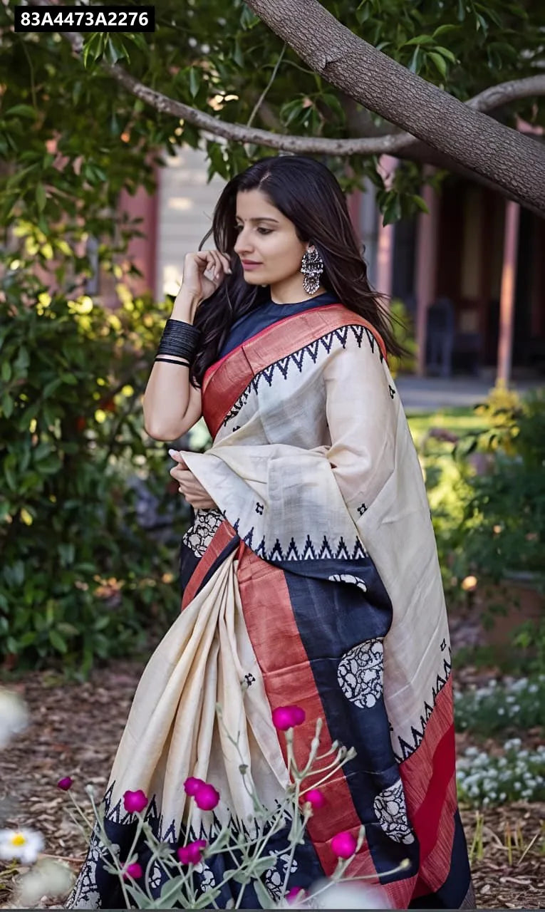 Elegant woman wearing TRENDBUY Cream Linen Digital Print Saree with Gold Zari border, outdoor setting.