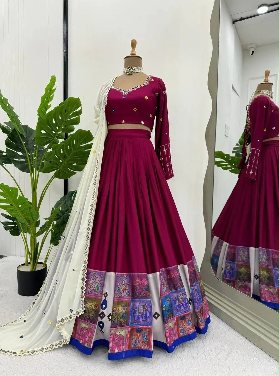 Magenta printed rayon lehenga choli with cream dupatta displayed on a mannequin