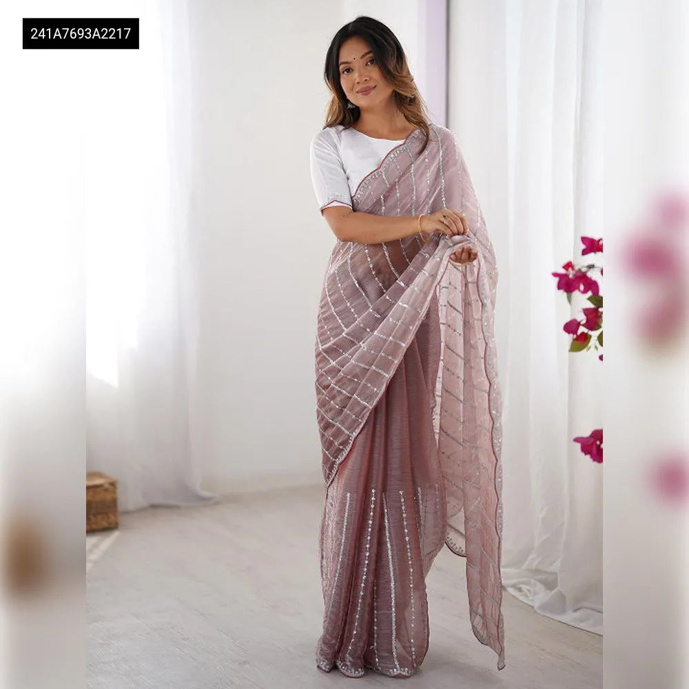 Model elegantly posing in a Dusty Mauve Zimmy Chiffon Saree with sequence work and white blouse, full body.