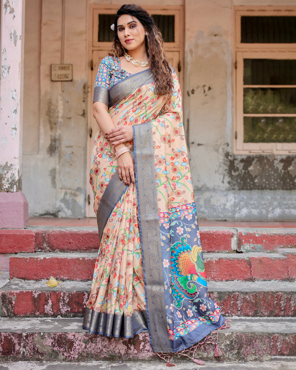 Woman posing in elegant Tussar silk saree with hand-painted floral design and zari border from TRENDBUY.