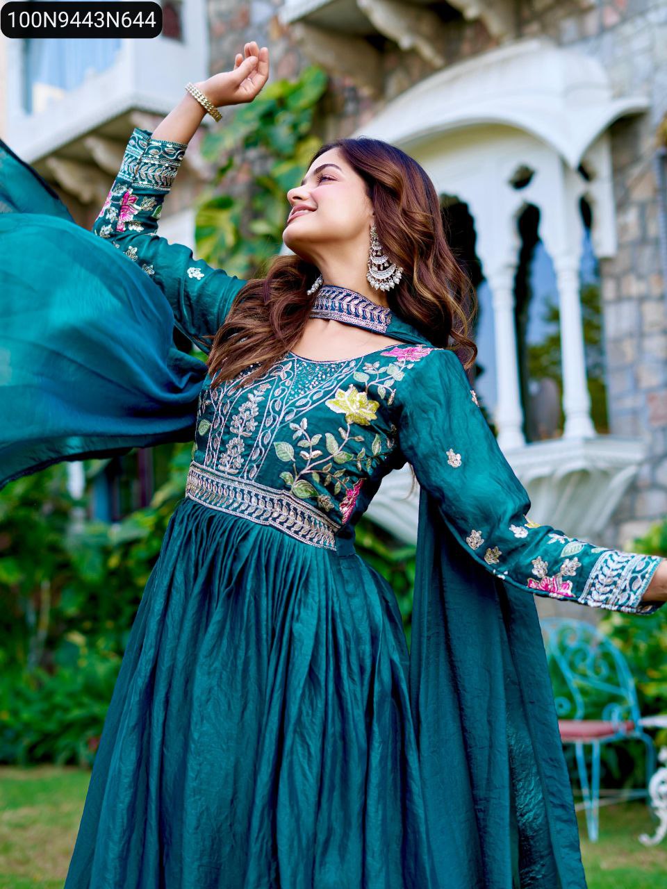Women's Teal Green Fendy Silk Anarkali Gown with heavy cording and thread embroidery, model posing outdoors
