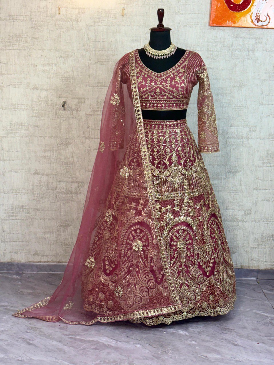 Berry Red Butterfly Net Lehenga with Gold Sequin Embroidery on Mannequin