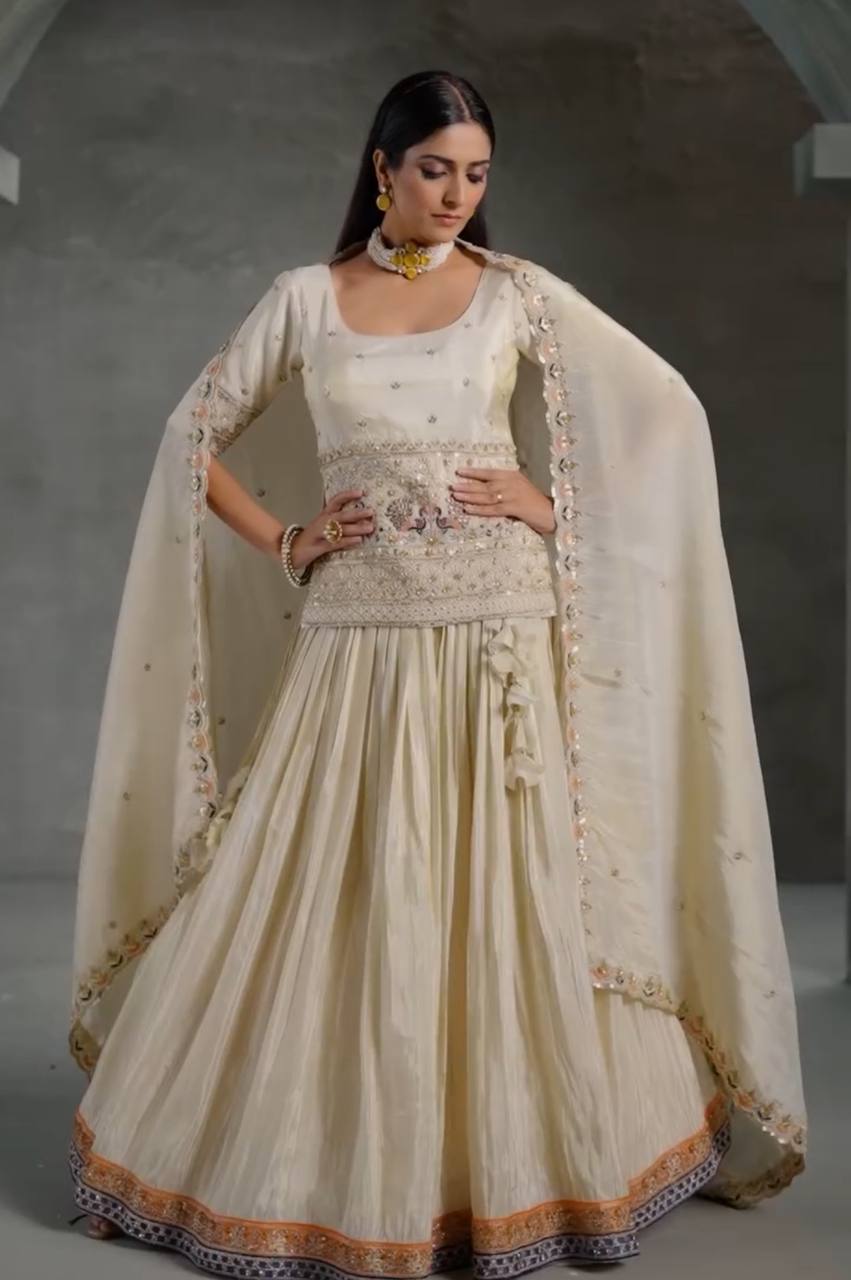 Elegant model in full Ivory Embroidered Chinon Crop Top Lehenga set, gracefully styled with matching dupatta.