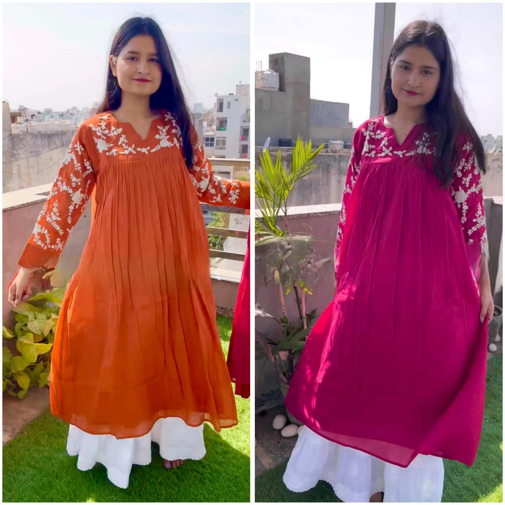 Model showcasing Rust Orange and Fuchsia Pink Chikankari A-line Gowns with white palazzo on a rooftop.