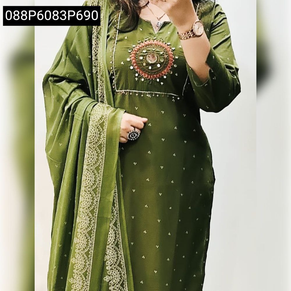 Green embroidered cotton kurta set with dupatta, woman posing.