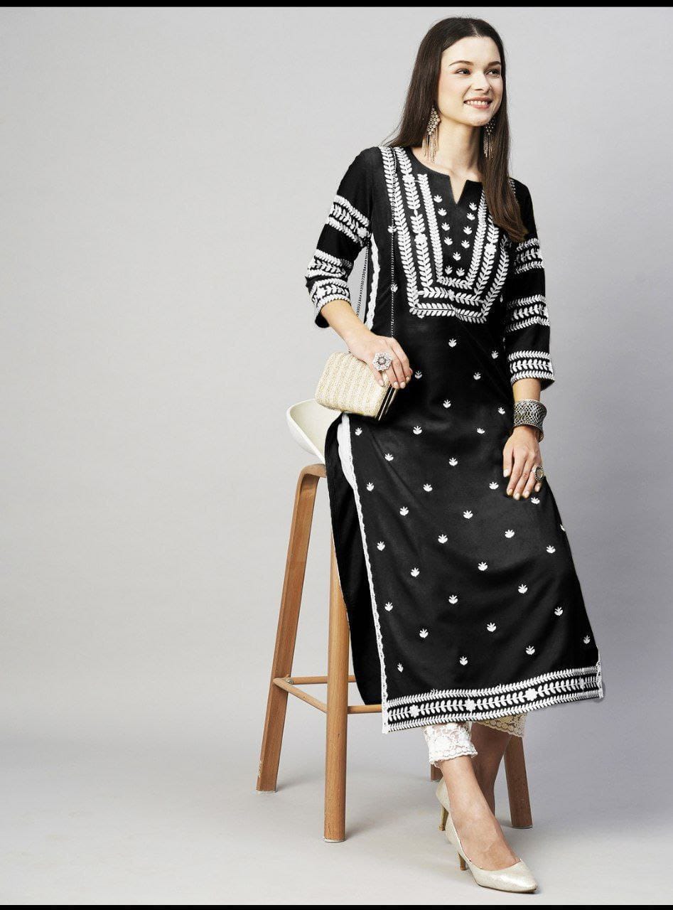Model wearing a TRENDBUY classic black embroidered cotton kurti, front view