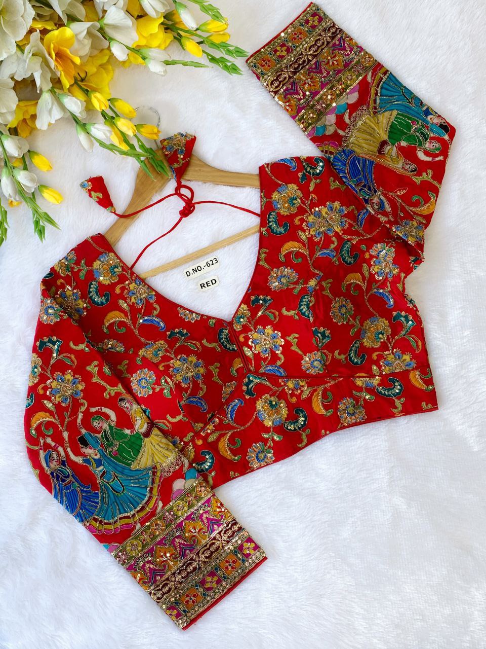 Red embroidered designer blouse with full sleeves, perfect for party wear, featuring intricate floral and figurative patterns.