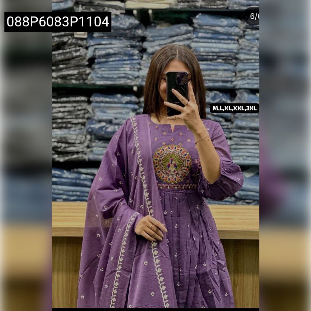 Woman in lavender embroidered flared cotton kurta set, holding phone, front view, in a store setting.