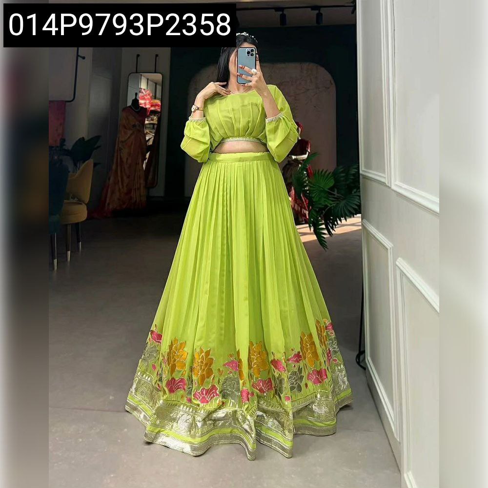 Full body front view of a woman posing in a mirror wearing a lime green embroidered Faux Georgette cordset.
