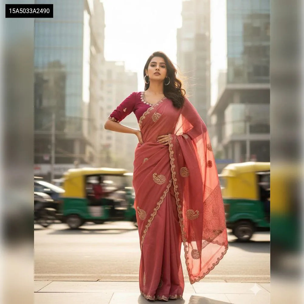 TRENDBUY model wearing an elegant dusty pink Star Georgette saree with intricate embroidery, paired with a maroon blouse, captured in an urban setting