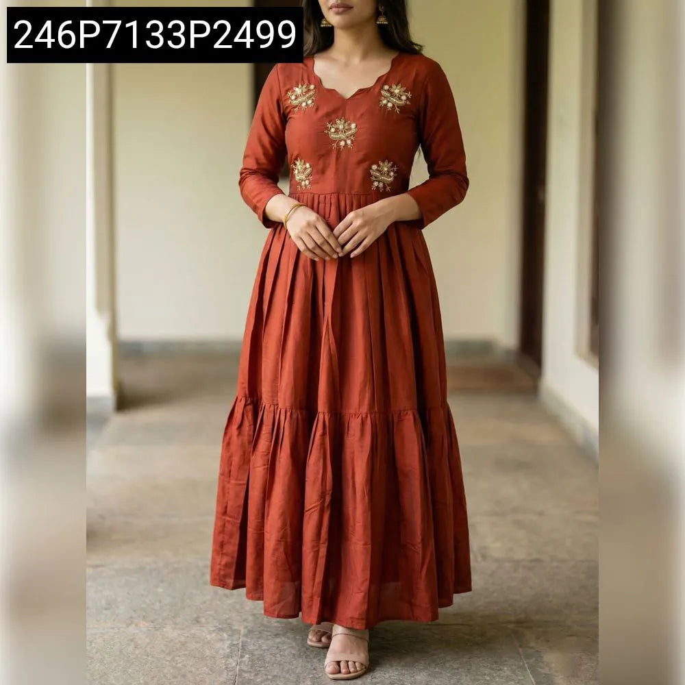 Full shot of woman wearing Rust Soft Roman Gown with Moti & Kardana handwork, standing front-facing