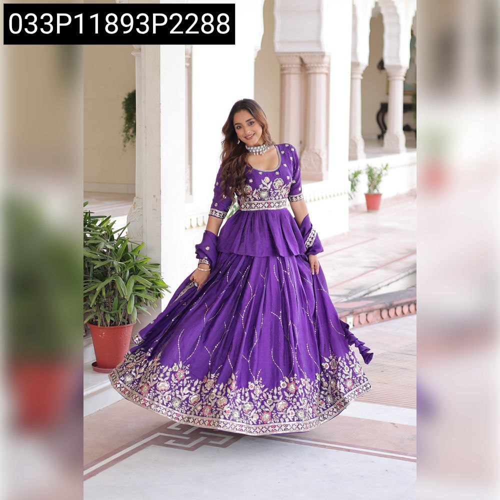 Model posing in a front-facing embroidered peplum lehenga set by TRENDBUY