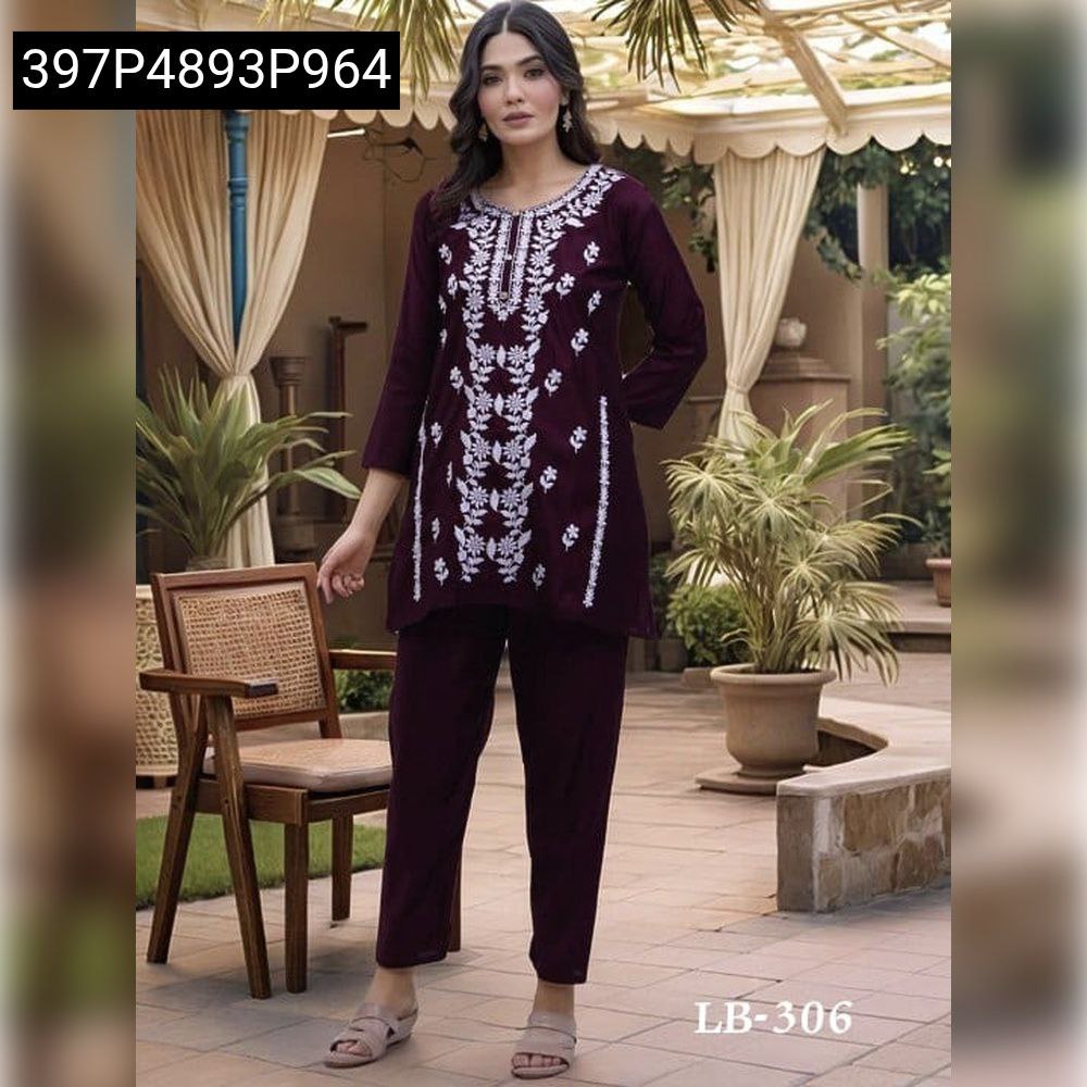 Model wearing a Wine Pure Rayon embroidered kurti and matching pants, front view