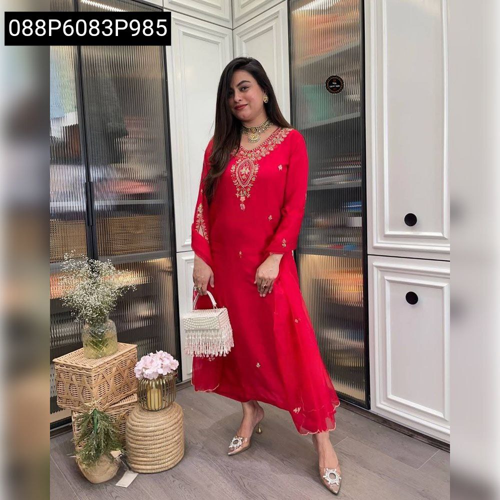Stylish woman showcasing a red embroidered rayon kurti set, front view, perfect for ethnic occasions.