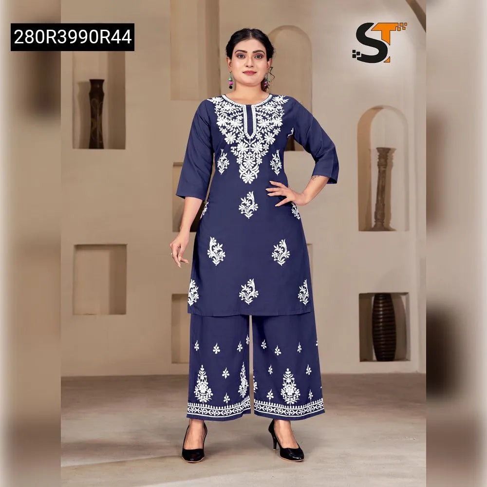 Woman posing in Navy Blue Embroidered Reyon Kurti Pant Set by TRENDBUY