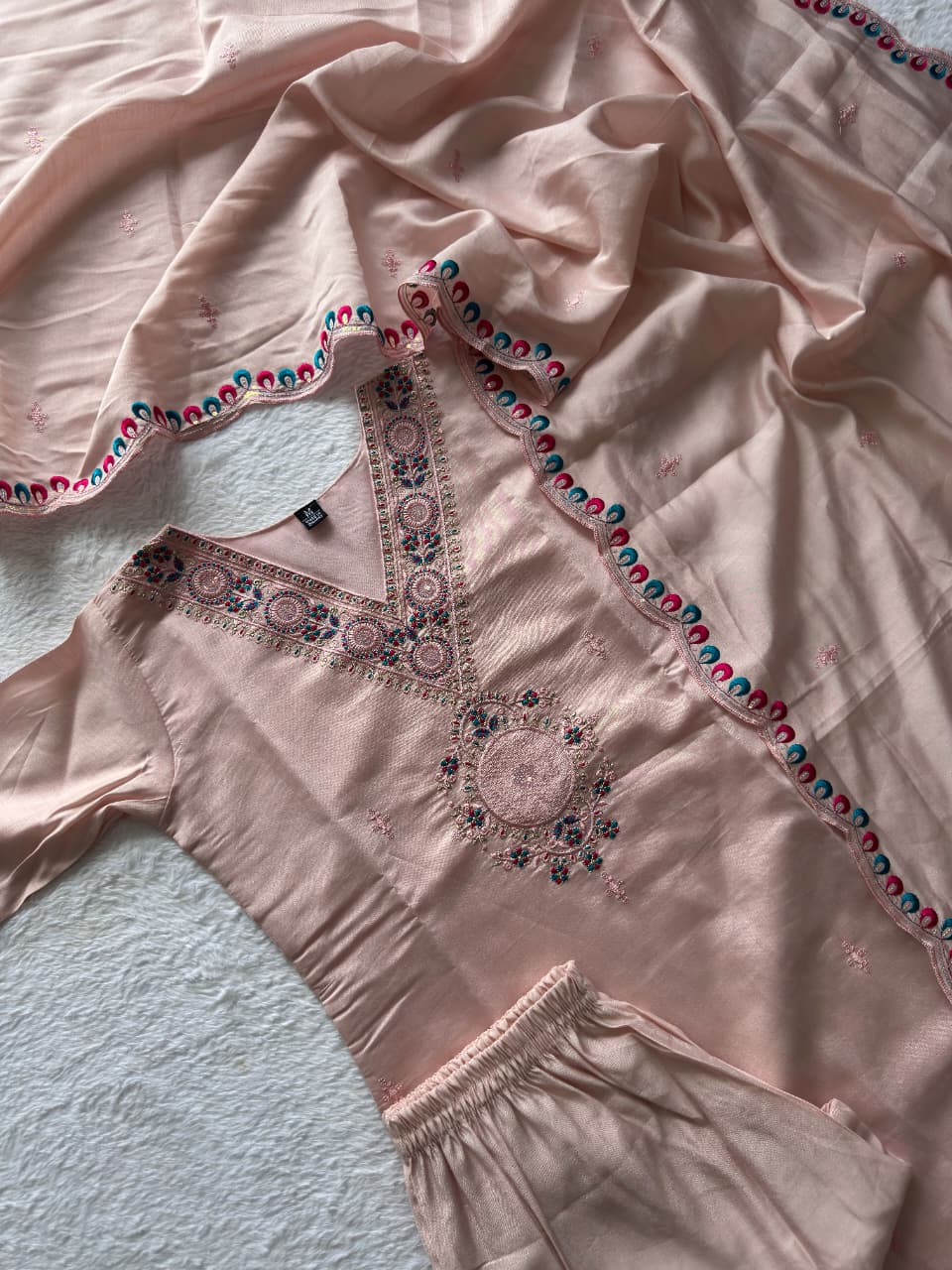 Full view of the light peach Roman silk kurti, pant, and dupatta set with intricate embroidery and sequence work by TRENDBUY.