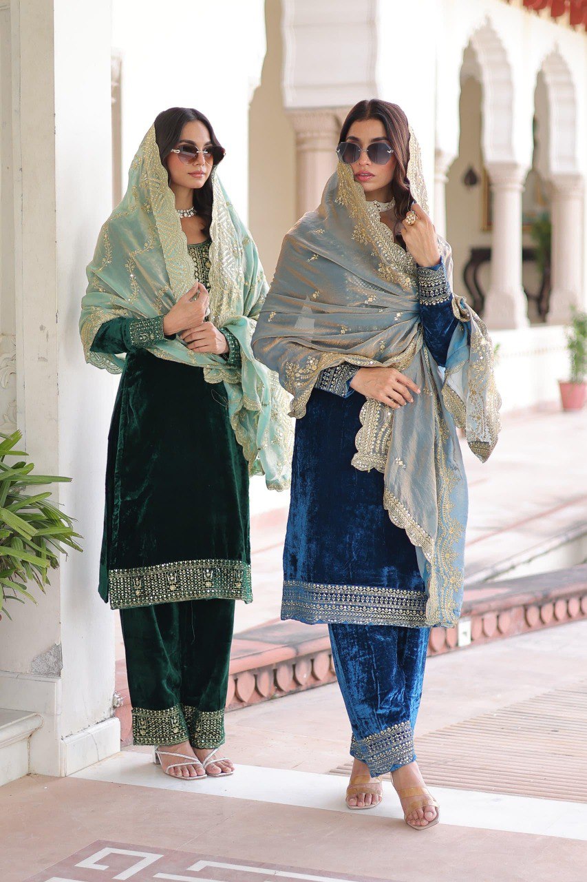 Two women showcasing green and Morpich velvet kurti sets with embroidery and dupattas.