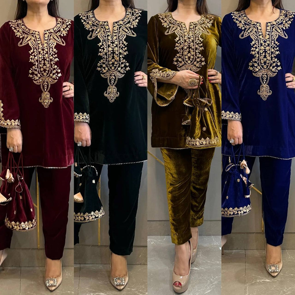 Group of four women in embroidered velvet top and pant sets in maroon, dark green, royal blue, and black.