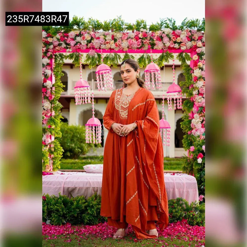 Model showcasing a TRENDBUY Pure Vichitra Silk Embroidered Kurta Set in Rust Orange, front facing.