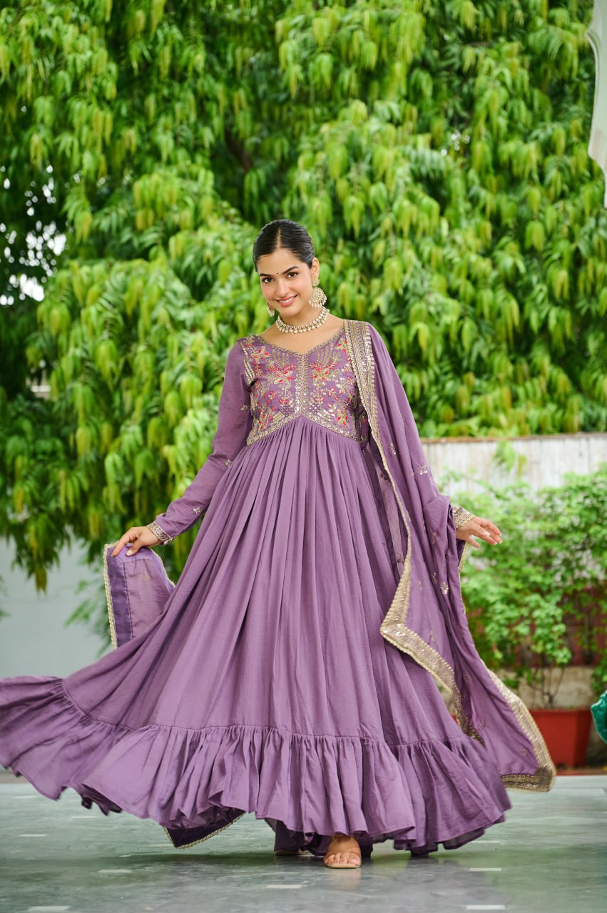 Elegant Women's Lavender Embroidered Vichitra Silk Gown with Dupatta, featuring rich zari work and a flowing 9-meter flair, perfect for party wear.