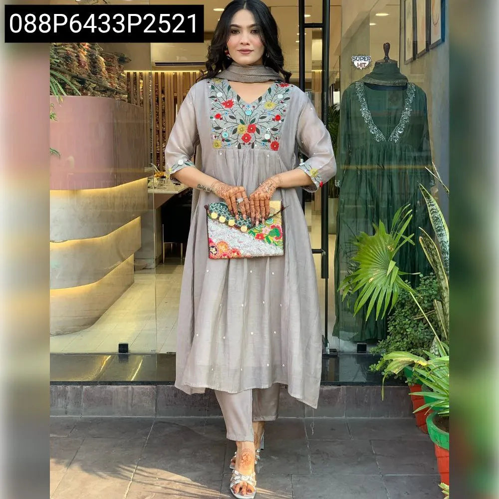 Front view of woman in grey embroidered Viscose Chinon suit set, looking at camera