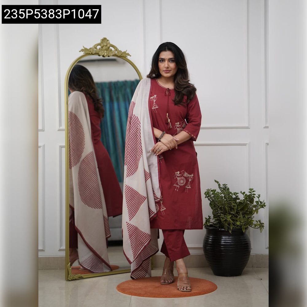 Woman posing in a maroon viscose rayon embroidered kurta set with a printed dupatta and matching pants.