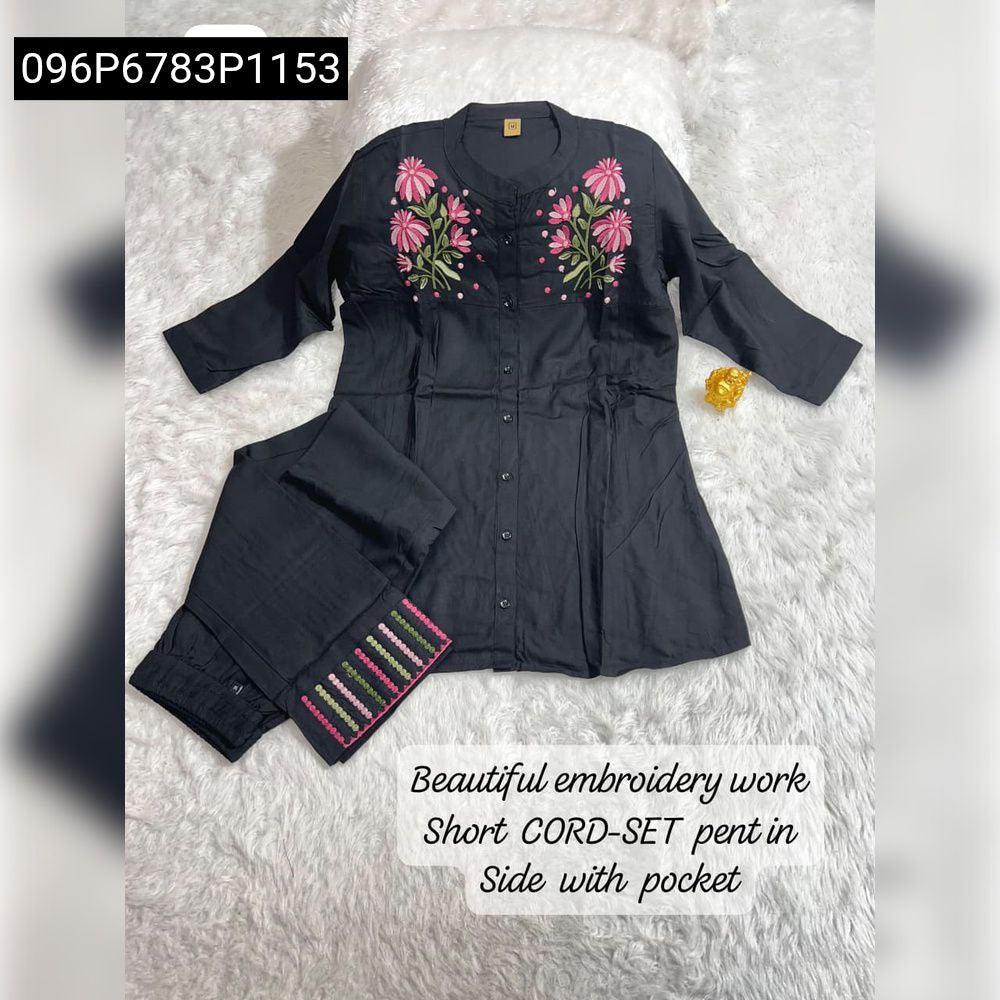 Black Women's Embroidery Viscose Short Co-ord Set with floral design, flat lay on white fluffy surface