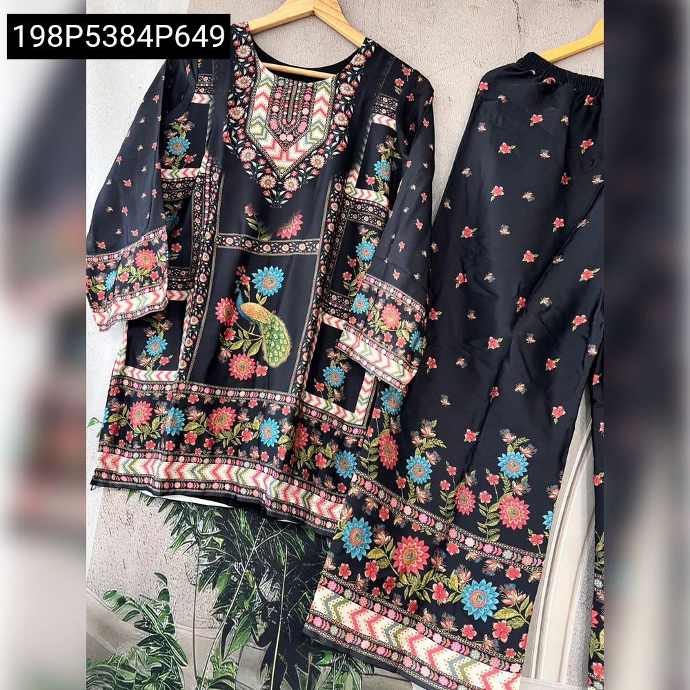 Elegant black digital printed satin crape silk kurti and pant set with vibrant floral and peacock motifs, laid flat.