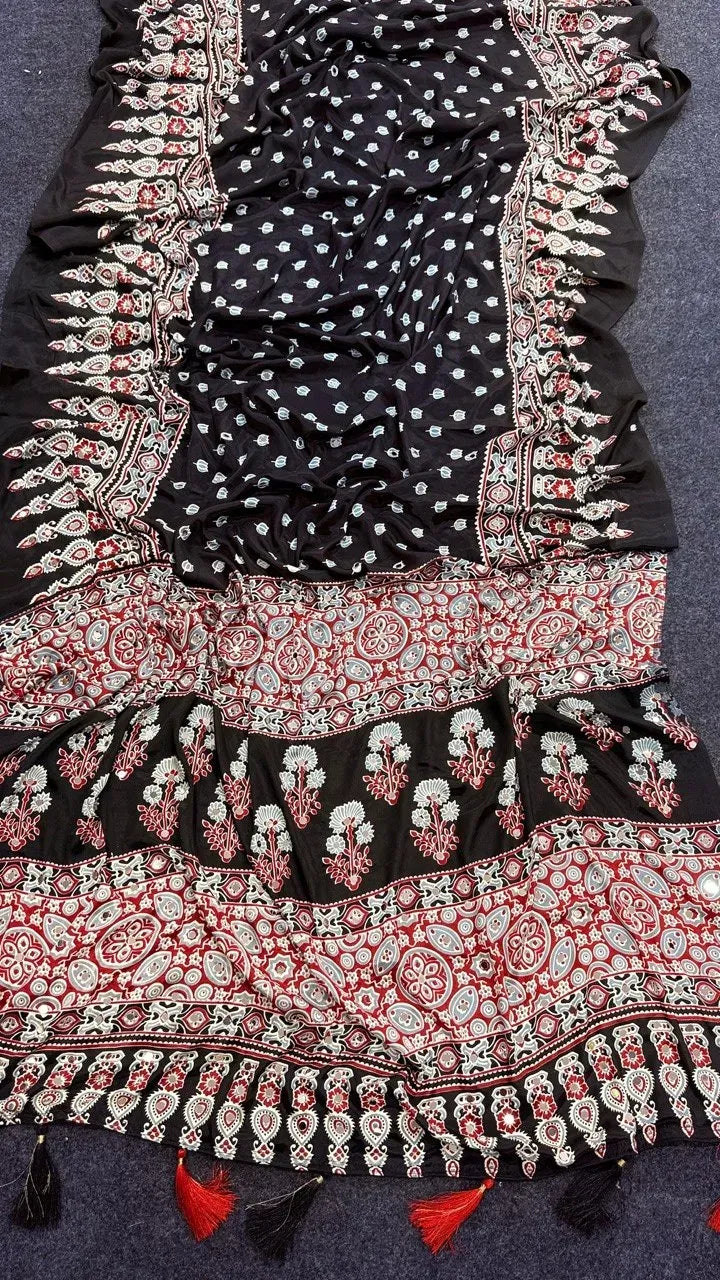 Black pure moss satin Ajrakh saree with intricate red and white patterns and mirror work