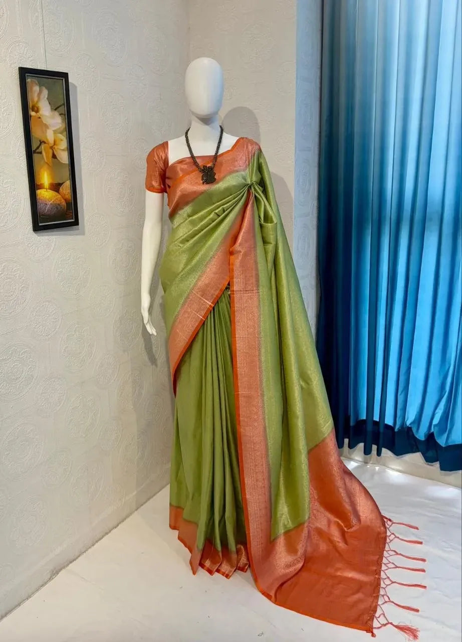 Green banarasi silk saree draped gracefully on a mannequin