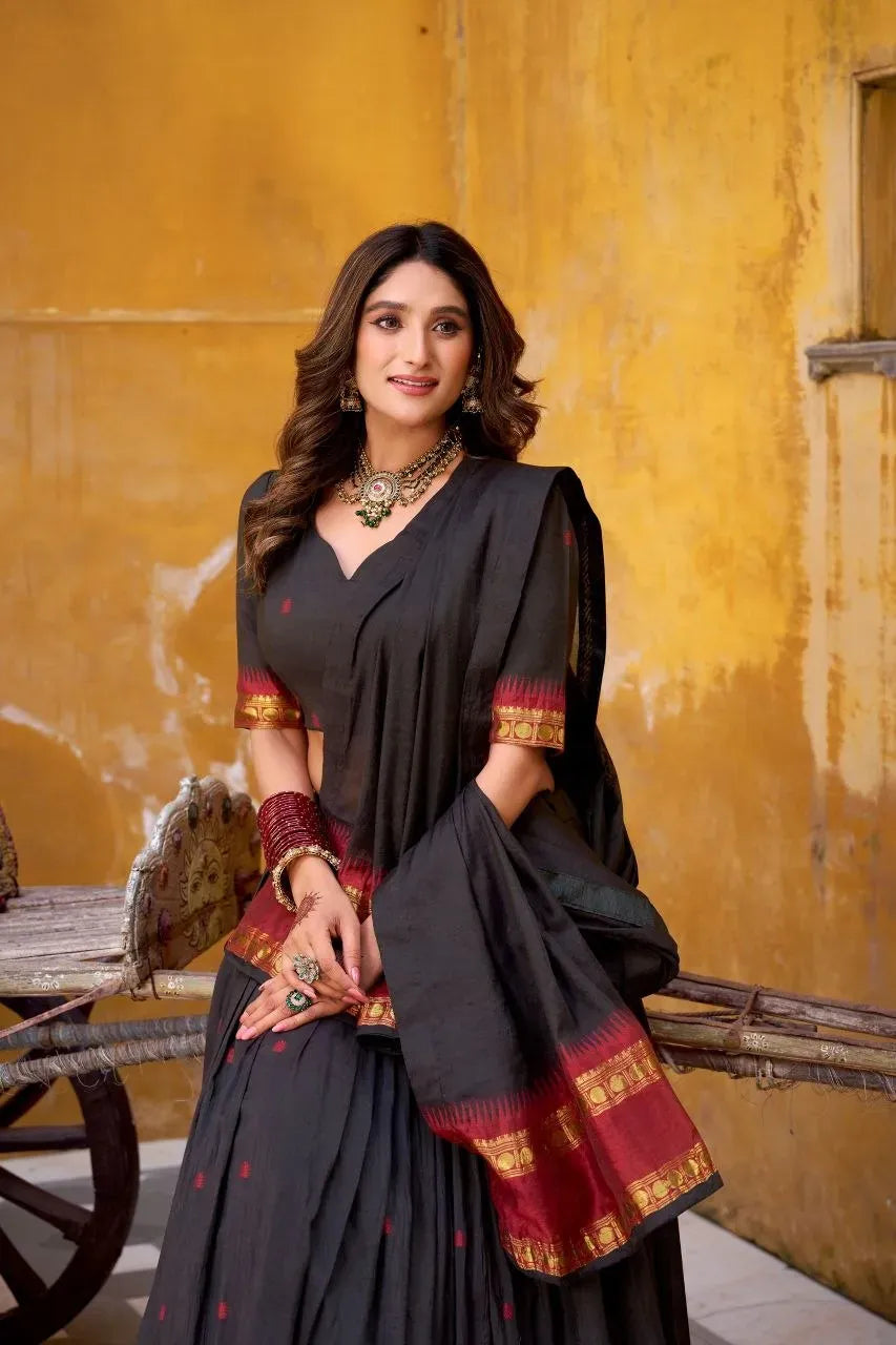 Woman wearing black Chanderi cotton lehenga choli with zari weaving work