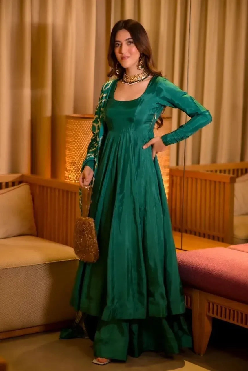 Model wearing green chinnon silk anarkali suit with matching dupatta