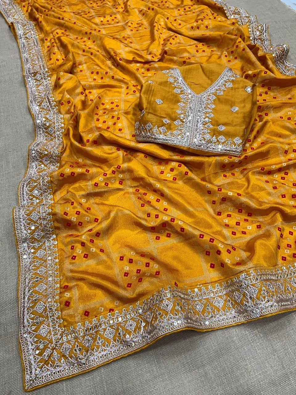 Yellow Chinon silk saree with bandhej print and embroidered blouse piece