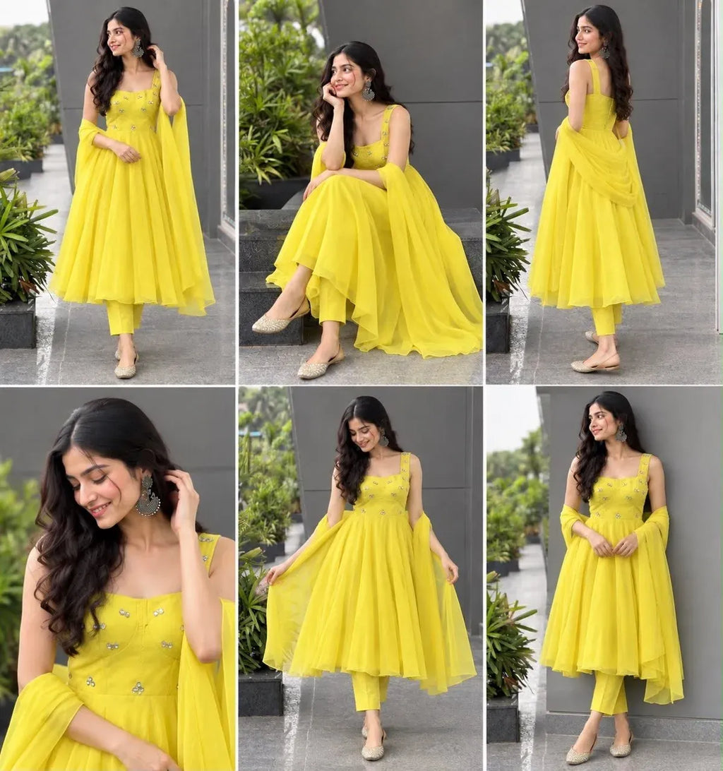 Model wearing bright yellow corset anarkali set with heavy flair