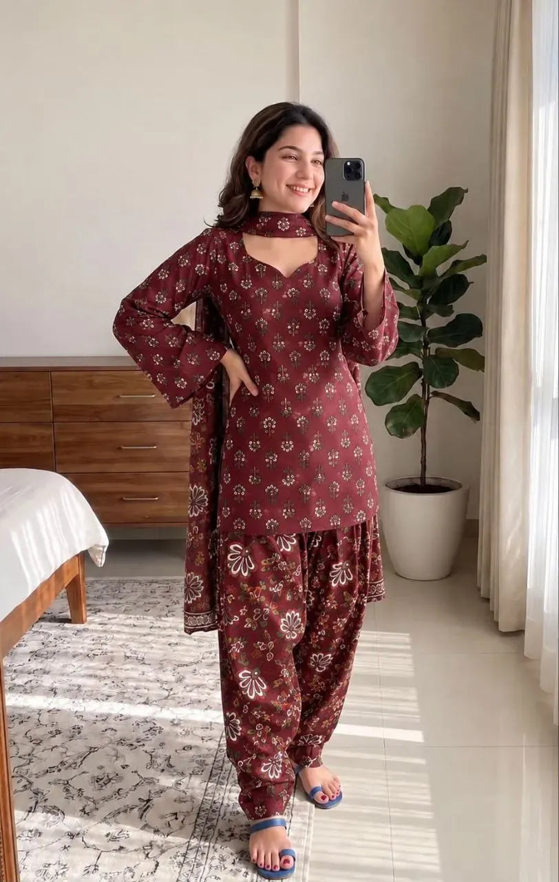 Model wearing maroon floral printed cotton farshi suit set with sweetheart neck