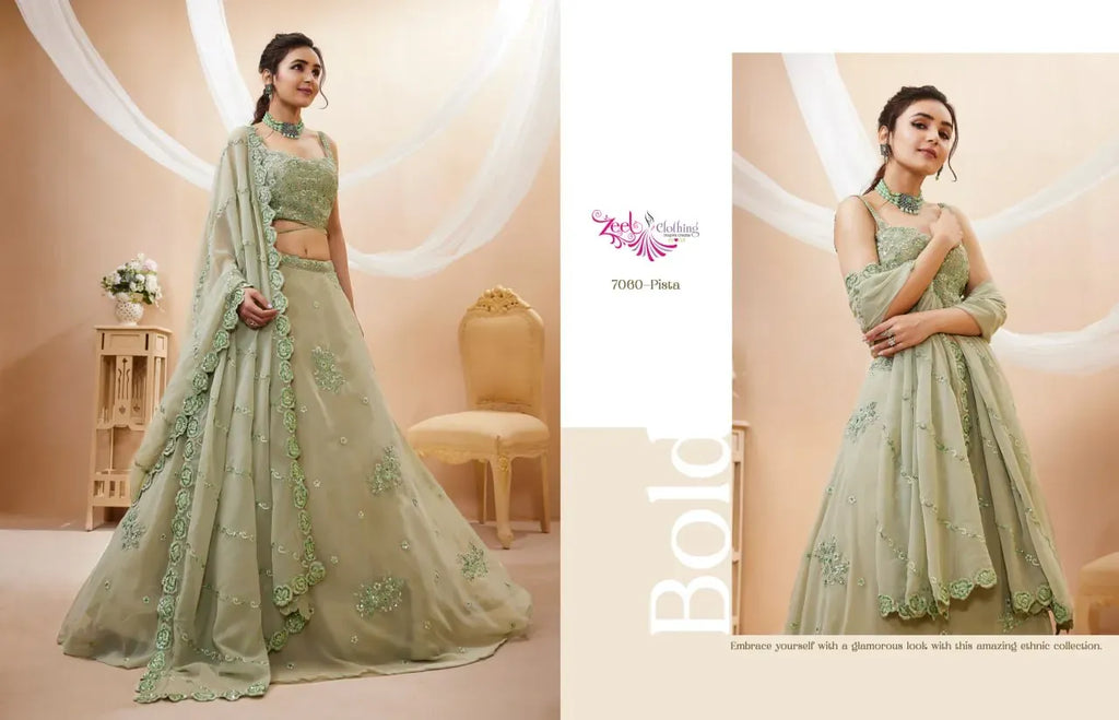 Model standing elegantly in pista green embroidered georgette lehenga