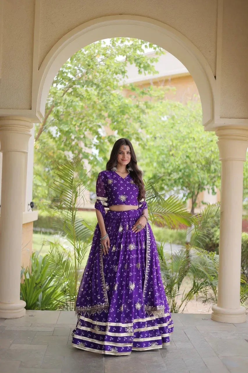 Model posing in purple georgette lehenga with sequin embroidery