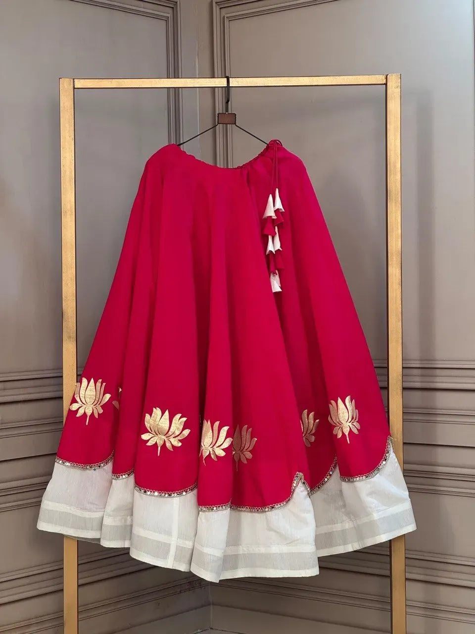 Magenta and white lehenga with gold lotus print and mirror lace
